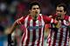MADRID, SPAIN - DECEMBER 21: Diego Costa (L) of Atletico de Madrid celebrates scoring their second goal with team-mate Diego Godin (R) during the La Liga match between Club Atletico de Madrid and Levante UD at Vicente Calderon Stadium on December 21, 201