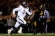 COLUMBIA, MO - NOVEMBER 30: Quarterback Johnny Manziel #2 of the Texas A&M Aggies scrambles as defensive lineman Harold Brantley #90 of the Missouri Tigers chases during the game on November 30, 2013 in Columbia, Missouri. (Photo by Jamie Squire/Getty I
