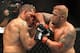 BRISBANE, AUSTRALIA - DECEMBER 07: Mark Hunt connects with an elbow during the UFC Brisbane bout between Mark Hunt and Antonio 'Big Foot' Silva of Brazil at the Brisbane Entertainment Centre on December 7, 2013 in Brisbane, Australia. (Photo by Bradley K