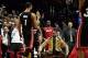 Dec 28, 2013; Portland, OR, USA; Miami Heat small forward LeBron James (middle) reacts after center Chris Bosh (1) hit the game winning shot during the fourth quarter of the game against the Portland Trail Blazers at the Moda Center. The Heat won the game