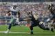 ARLINGTON, TX - SEPTEMBER 22: DeMarco Murray #29 of the Dallas Cowboys runs the ball against Chris Long #91 of the St. Louis Rams at AT&T Stadium on September 22, 2013 in Arlington, Texas. (Photo by Ronald Martinez/Getty Images)