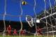 LONDON, ENGLAND - DECEMBER 29: Goalkeeper Simon Mignolet of Liverpool dives in vain as Eden Hazard of Chelsea scores his team's first goal during the Barclays Premier League match between Chelsea and Liverpool at Stamford Bridge on December 29, 2013 in L