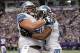 Dec 29, 2013; Minneapolis, MN, USA; Detroit Lions running back Reggie Bush (21) celebrates with center Dominic Raiola (51) after scoring a touchdown in the third quarter against the Minnesota Vikings at Mall of America Field at H.H.H. Metrodome. Mandatory