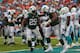 MIAMI GARDENS, FL - DECEMBER 29: Bilal Powell #29 and Sheldon Richardson #91 of the New York Jets celebrate a touchdown during a game against the Miami Dolphins at Sun Life Stadium on December 29, 2013 in Miami Gardens, Florida. (Photo by Mike Ehrmann/G