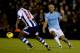 WEST BROMWICH, ENGLAND - DECEMBER 04: Vincent Kompany of Manchester City is challenged by Saido Berahino of West Bromwich Albion during the Barclays Premier League match between West Bromwich Albion and Manchester City at The Hawthorns on December 4, 201