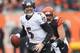 CINCINNATI, OH - DECEMBER 29: Joe Flacco #5 of the Baltimore Ravens runs the football upfield during the game against the Cincinnati Bengals at Paul Brown Stadium on December 29, 2013 in Cincinnati, Ohio. (Photo by John Grieshop/Getty Images)