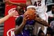 ATLANTA, GA - DECEMBER 18: DeMarcus Cousins #15 of the Sacramento Kings draws a foul from Elton Brand #42 of the Atlanta Hawks at Philips Arena on December 18, 2013 in Atlanta, Georgia. NOTE TO USER: User expressly acknowledges and agrees that, by downl
