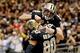 Dec 29, 2013; New Orleans, LA, USA; New Orleans Saints quarterback Drew Brees (9) celebrates with teammate tight end Jimmy Graham (80) following a touchdown during the fourth quarter of a game against the Tampa Bay Buccaneers at the Mercedes-Benz Superdom
