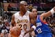 LOS ANGELES, CA - DECEMBER 29: Jodie Meeks #20 of the Los Angeles Lakers drives to the basket against Evan Turner #12 of the Philadelphia 76ers at STAPLES Center on December 29, 2013 in Los Angeles, California. NOTE TO USER: User expressly acknowledges an