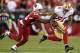 GLENDALE, AZ - DECEMBER 29: Wide receiver Anquan Boldin #81 of the San Francisco 49ers runs with the football after a reception past cornerback Jerraud Powers #25 of the Arizona Cardinals during the NFL game at the University of Phoenix Stadium on Decemb
