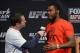 December 13, 2013; Sacramento, CA, USA; UFC light heavyweight Jon Jones (right) is interviewed on stage for the announcement of the EA Sports UFC video game cover winner before the official weigh-in for UFC on FOX 9 at Sleep Train Arena. Mandatory Credit: