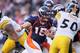 DENVER, CO - JANUARY 08: Quarterback Tim Tebow #15 of the Denver Broncos carries the ball during the AFC Wild Card Playoff game against the Pittsburgh Steelers at Sports Authority Field at Mile High on January 8, 2012 in Denver, Colorado. (Photo by Jeff