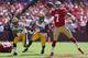 SAN FRANCISCO, CA - SEPTEMBER 08: Quarterback Colin Kaepernick #7 of the San Francisco 49ers is pursued by Micah Hyde #33 and Mike Neal #96 of the Green Bay Packers at Candlestick Park on September 8, 2013 in San Francisco, California. (Photo by Jeff Gr