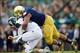 Sep 21, 2013; South Bend, IN, USA; Notre Dame Fighting Irish defensive end Stephon Tuitt (7) sacks Michigan State Spartans quarterback Connor Cook (18) in the fourth quarter at Notre Dame Stadium. Notre Dame won 17-13. Mandatory Credit: Matt Cashore-USA T