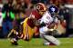 LANDOVER, MD - DECEMBER 01: Brian Orakpo #98 of the Washington Redskins sacks Eli Manning #10 of the New York Giants in the first quarter during their game at FedExField on December 1, 2013 in Landover, Maryland. (Photo by Rob Carr/Getty Images)