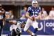 INDIANAPOLIS, IN - DECEMBER 28: Andrew Luck #12 of the Indianapolis Colts outruns the tackle of Jason Babin #58 of the Jacksonville Jaguars during the second quarter at Lucas Oil Stadium on December 29, 2013 in Indianapolis, Indiana. (Photo by Gregory