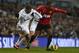 LONDON, ENGLAND - JANUARY 20: Aaron Lennon of Tottenham Hotspur and Patrice Evra of Manchester United compete for the ball during the Barclays Premier League match between Tottenham Hotspur and Manchester United at White Hart Lane on January 20, 2013 in L