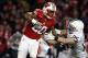 Nov 30, 2013; Madison, WI, USA; Wisconsin Badgers running back James White (20) rushes as Penn State Nittany Lions safety Von Walker (25) defends at Camp Randall Stadium. Penn State defeated Wisconsin 31-24. Mandatory Credit: Mary Langenfeld-USA TODAY Spo