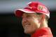 IMOLA, ITALY - APRIL 21: Michael Schumacher of Germany and Ferrari smiles in the paddock during the previews for the San Marino F1 Grand Prix at the San Marino Circuit on April 21, 2005, in Imola, Italy. (Photo by Clive Mason/Getty Images)
