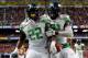 SAN ANTONIO, TX - DECEMBER 30: Linebacker Derrick Malone #22 celebrates a pick six with defensive end Tony Washington #91 of the Oregon Ducks against the Texas Longhorns during the Valero Alamo Bowl at the Alamodome on December 30, 2013 in San Antonio, Te