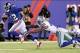 Nov 24, 2013; East Rutherford, NJ, USA; New York Giants wide receiver Jerrel Jernigan (12) runs past Dallas Cowboys safety Barry Church (42) during the second quarter of a game at MetLife Stadium. Mandatory Credit: Brad Penner-USA TODAY Sports