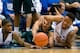 DURHAM, NC - DECEMBER 28: Amile Jefferson #21 and Jabari Parker #1 of the Duke Blue Devils go to the floor with Raven Lee #0 of the Eastern Michigan Eagles as they battle for a loose ball during their game at Cameron Indoor Stadium on December 28, 2013 i