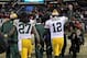 CHICAGO, IL - DECEMBER 29: Aaron Rodgers #12 of the Green Bay Packers pumps his fist as he walks off of the field with teammate Eddie Lacy #27 after a win against the Chicago Bears at Soldier Field on December 29, 2013 in Chicago, Illinois. The Packers d