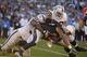 Dec 22, 2013; San Diego, CA, USA; Oakland Raiders defensive tackles Pat Sims (90) and Vance Walker (98) tackle San Diego Chargers running back Ryan Matthews at Qualcomm Stadium. The Chargers won 26-13. Mandatory Credit: Kirby Lee-USA TODAY Sports
