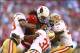 Donte Whitner (No. 31)—49ers' defensive backs leader and 2014 free agent—joins in on a tackle of Larry Fitzgerald.
