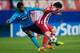 MADRID, SPAIN - DECEMBER 11: Alex Sandro (L) of FC Porto tackles David Villa (R) of Atletico de Madrid during the UEFA Champions League Group G match at Vicente Calderon Stadium on December 11, 2013 in Madrid, Spain. (Photo by Gonzalo Arroyo Moreno/Getty