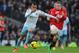 MANCHESTER, ENGLAND - DECEMBER 21: Ravel Morrison of West Ham United competes with Wayne Rooney of Manchester United during the Barclays Premier League match between Manchester United and West Ham United at Old Trafford on December 21, 2013 in Manchester