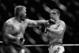 BRISBANE, AUSTRALIA - DECEMBER 07: (This digital image has been converted to black & white) Mark Hunt punches Antonio 'Bigfoot' Silva in their heavyweight fight during the UFC Fight Night event at the Brisbane Entertainment Centre on December 7, 2013 in