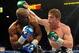 Sep 14, 2013; Las Vegas, NV, USA; Floyd Mayweather Jr. (blue gloves) and Canelo Alvarez battle it during their during their WBC and WBA super welterweight titles fight at MGM Grand Garden Arena. Mandatory Credit: Jayne Kamin-Oncea-USA TODAY Sports