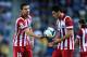 BARCELONA, SPAIN - OCTOBER 19: Gabi Fernandez (L) and his teammate Koke Resurreccion of Atletico de Madrid chat before a free-kick during the La Liga match between RCD Espanyol and Club Atletico de Madrid at Cornella-El Prat Stadium on October 19, 2013 i