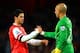 LONDON, ENGLAND - DECEMBER 08: Mikel Arteta of Arsenal shakes hands with Tim Howard of Everton at the final whistle during the Barclays Premier League match between Arsenal and Everton at Emirates Stadium on December 8, 2013 in London, England. (Photo by