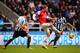 NEWCASTLE UPON TYNE, ENGLAND - DECEMBER 29: Nicklas Bendtner of Arsenal is closed down by Michael Williamson and Cheick Tiote of Newcastle United during the Barclays Premier League match between Newcastle United and Arsenal at St James' Park on December 2