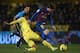 VILLARREAL, SPAIN - JANUARY 28: Mateo Musacchio (L) of Villarreal competes for the ball with Lionel Messi of Barcelona during the la Liga match between Villarreal and Barcelona at El Madrigal on January 28, 2012 in Villarreal, Spain. (Photo by Manuel Qu