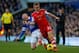 LIVERPOOL, ENGLAND - DECEMBER 29: Luke Shaw of Southampton is tackled by Steven Naismith of Everton during the Barclays Premier League match between Everton and Southampton at Goodison Park on December 29, 2013 in Liverpool, England. (Photo by Paul Thom