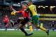 NORWICH, ENGLAND - DECEMBER 28: Nemanja Vidic of Manchester United battles with Gary Hooper of Norwich City during the Barclays Premier League match between Norwich City and Manchester United at Carrow Road on December 28, 2013 in Norwich, England. (Ph