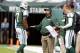 EAST RUTHERFORD, NJ - OCTOBER 13: Offensive coordinator Marty Mornhinweg of the New York Jets talks with quarterback Geno Smith #7 as back up quarterback Matt Simms #5 listens in during a game against the Pittsburgh Steelers at MetLife Stadium on October