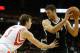 HOUSTON, TX - NOVEMBER 29: Brook Lopez #11 of the Brooklyn Nets works the ball against Omer Asik #3 of the Houston Rockets during the game at Toyota Center on November 29, 2013 in Houston, Texas. NOTE TO USER: User expressly acknowledges and agrees that,