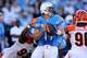 SAN DIEGO, CA - DECEMBER 01: Quarterback Philip Rivers #17 of the San Diego Chargers trys to pass against the rush of defensive tackle Domata Peko #93 of Cincinnati Bengals at Qualcomm Stadium on December 1, 2013 in San Diego, California. The Bengals won
