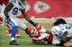 Dec 22, 2013; Kansas City, MO, USA; Kansas City Chiefs quarterback Alex Smith (11) is tackled by Indianapolis Colts outside linebacker Robert Mathis (98) and defensive tackle Ricardo Mathews (91) during the second half at Arrowhead Stadium. The Colts won
