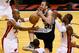 MIAMI, FL - JUNE 18: Manu Ginobili #20 of the San Antonio Spurs loses the ball as he drives between Ray Allen #34 and Dwyane Wade #3 of the Miami Heat in overtime during Game Six of the 2013 NBA Finals at AmericanAirlines Arena on June 18, 2013 in Miami,