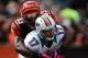 Oct 7, 2012; Columbus, OH, USA; Miami Dolphins quarterback Ryan Tannehill (17) is sacked by Cincinnati Bengals defensive end Michael Johnson (93) in the first quarter at Paul Brown Stadium. Mandatory Credit: Andrew Weber-USA TODAY Sports