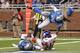 DETROIT, MI - DECEMBER 22: Jerrel Jemigan #12 of the New York Giants scores on a 20 yard touchdown pass from Eli Manning #10 during the second quarter of the game as Louis Delmas #26 and Bill Bentley #28 of the Detroit Lions attempts to defend on Decembe