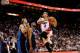 Nov 15, 2013; Miami, FL, USA; Miami Heat small forward Michael Beasley (right) drives to the basket as Dallas Mavericks power forward Dirk Nowitzki (far left) and shooting guard Vince Carter (center) look on during the second half at American Airlines Are