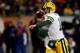 CHICAGO, IL - DECEMBER 29: Quarterback Aaron Rodgers #12 of the Green Bay Packers looks to pass against the Chicago Bears during a game at Soldier Field on December 29, 2013 in Chicago, Illinois. (Photo by Jonathan Daniel/Getty Images)