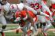 CHAMPAIGN, IL - NOVEMBER 16: Armani Reeves #26 of the Ohio State Buckeyes brings down V'Angelo Bentley #2 of the Illinois Fighting Illini at Memorial Stadium on November 16, 2013 in Champaign, Illinois. (Photo by Jonathan Daniel/Getty Images)
