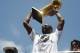 LOS ANGELES - JUNE 21: Kobe Bryant #24 of the Los Angeles Lakers hoists the championship trophy during the Los Angeles Lakers Championship Parade on June 21, 2010 in Los Angeles, California. NOTE TO USER: User expressly acknowledges and agrees that, by d